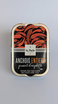 Hele ansjovis in olijfolie met Espelette peper